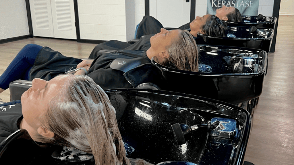 women getting their hair washed at paradigm hair salons panama city florida