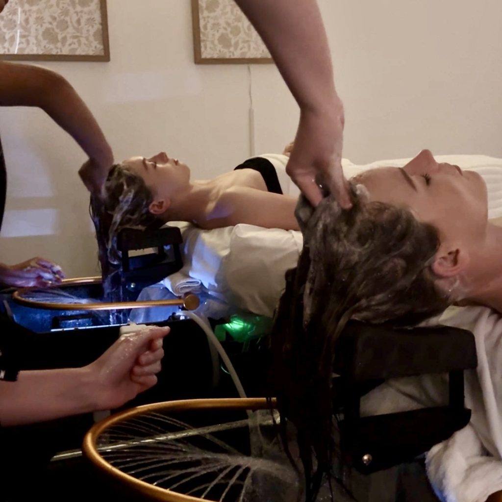 two girls getting headspa treatment in panama city florida